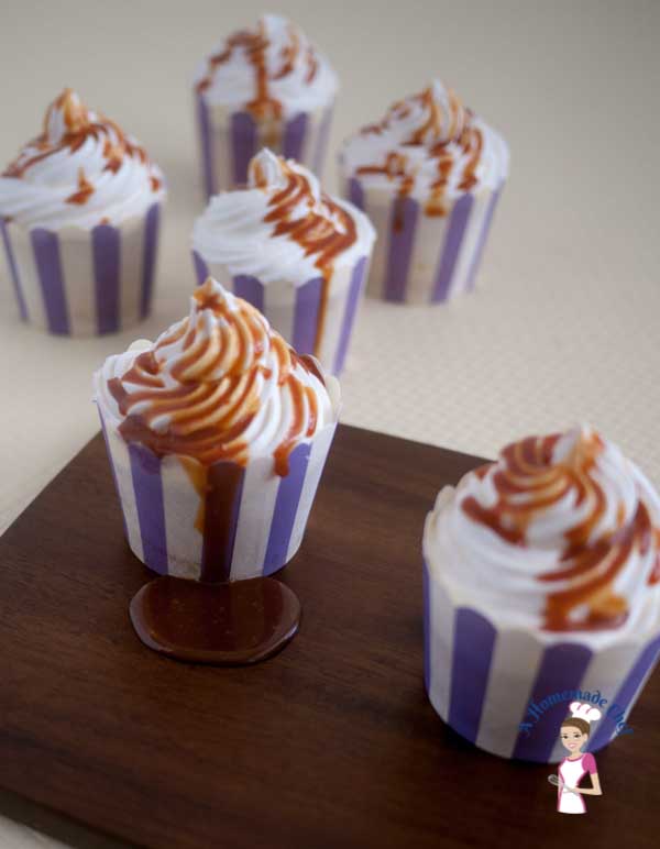 This Caramel Cupcake recipes is simply the most decadent you can get, with a light and fluffy Vanilla Sponge on the inside; filled with soft sweet caramel, topped with delicious Swiss Meringue Buttercream and then drizzled with some more caramel again by food blog A Homemade Chef.
