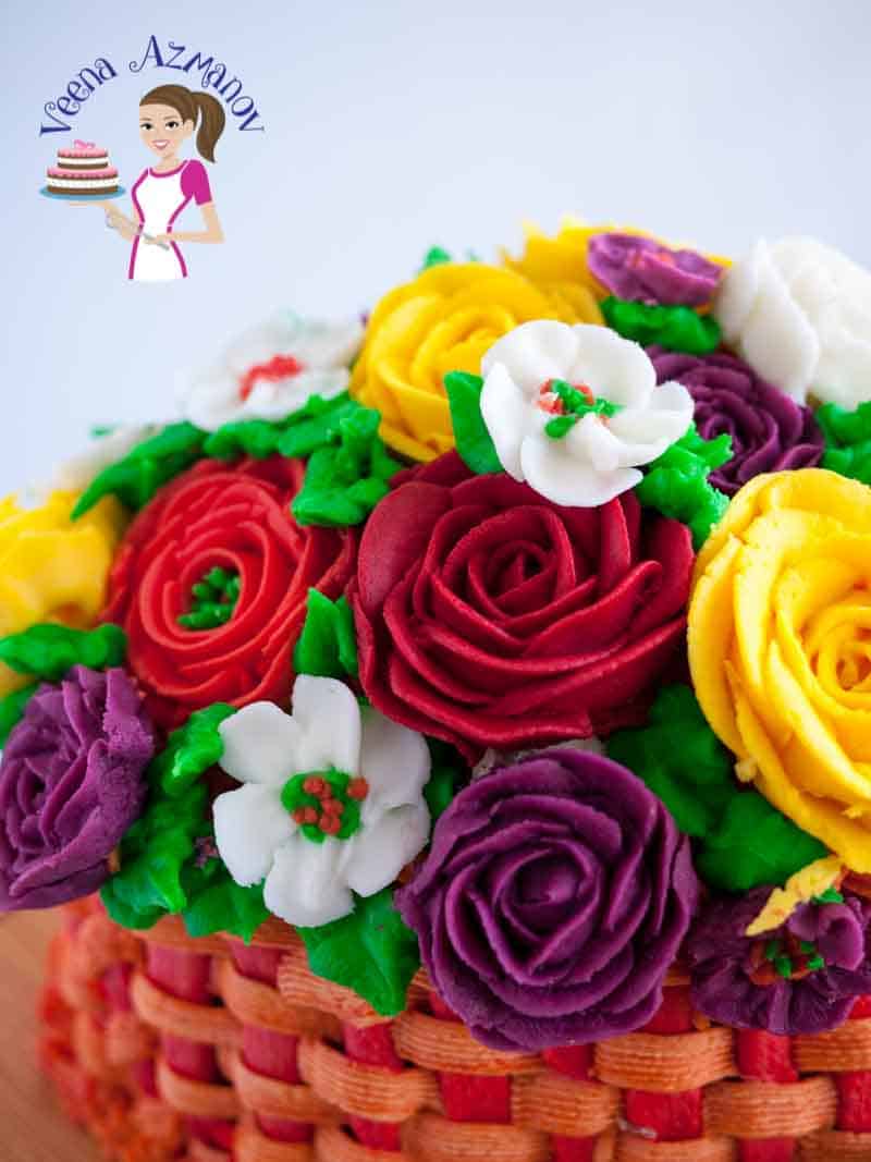 A close up of a cake decorated like a basket of flowers.
