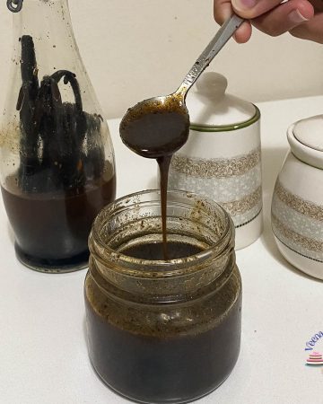 A mason jar with vanilla bean paste