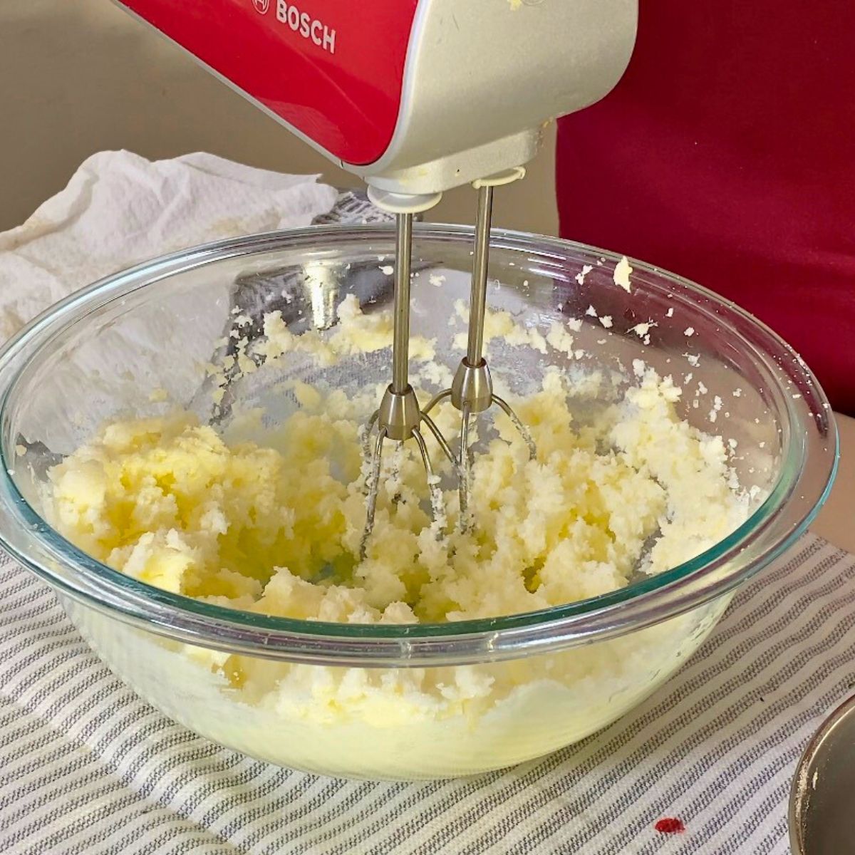 Progress pictures creaming the butter and sugar for cake.