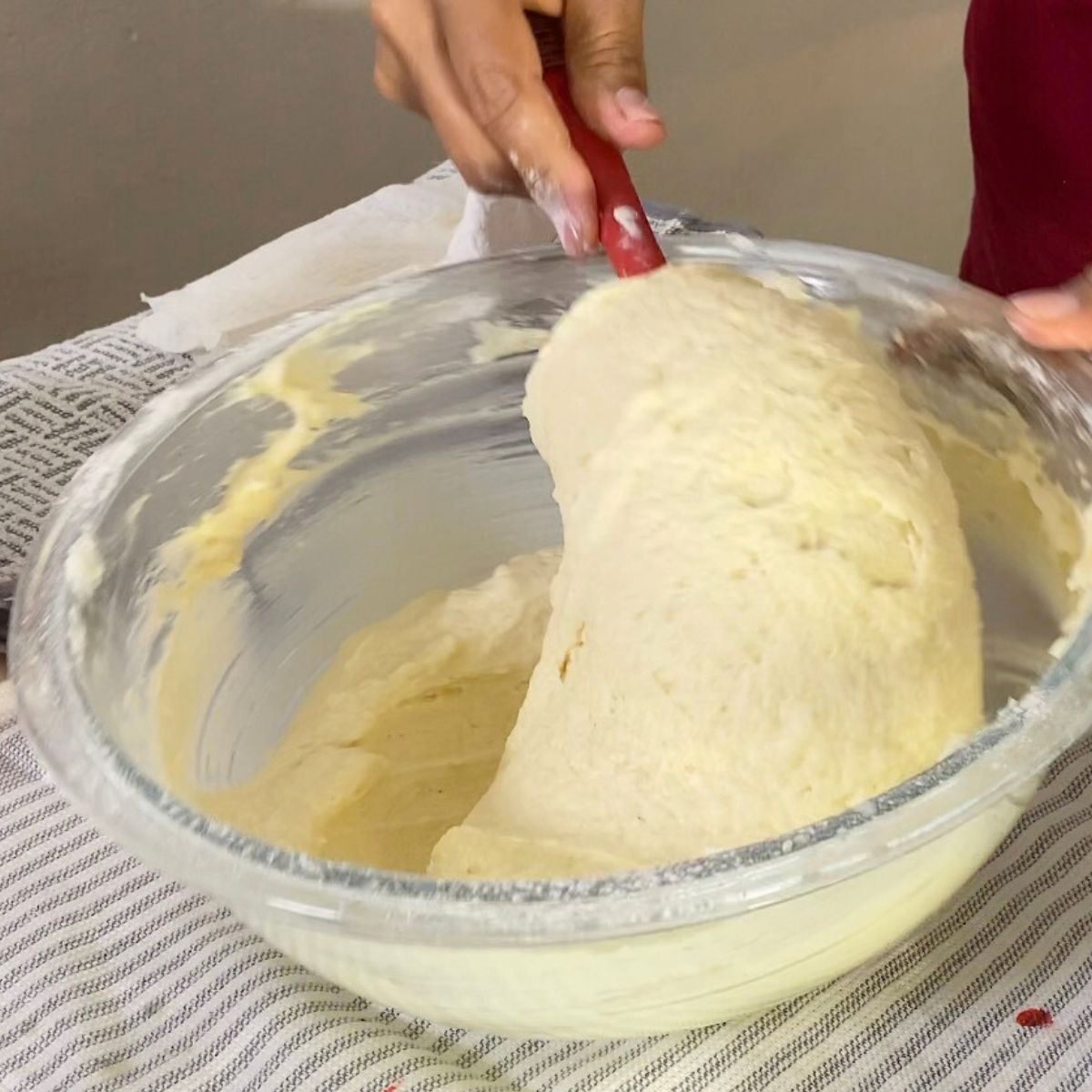Vanilla cake batter in a glass bowl.