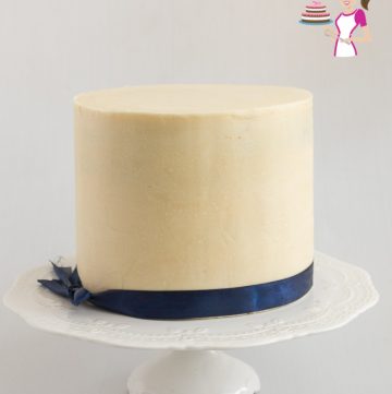 A cake covered with white chocolate ganache.