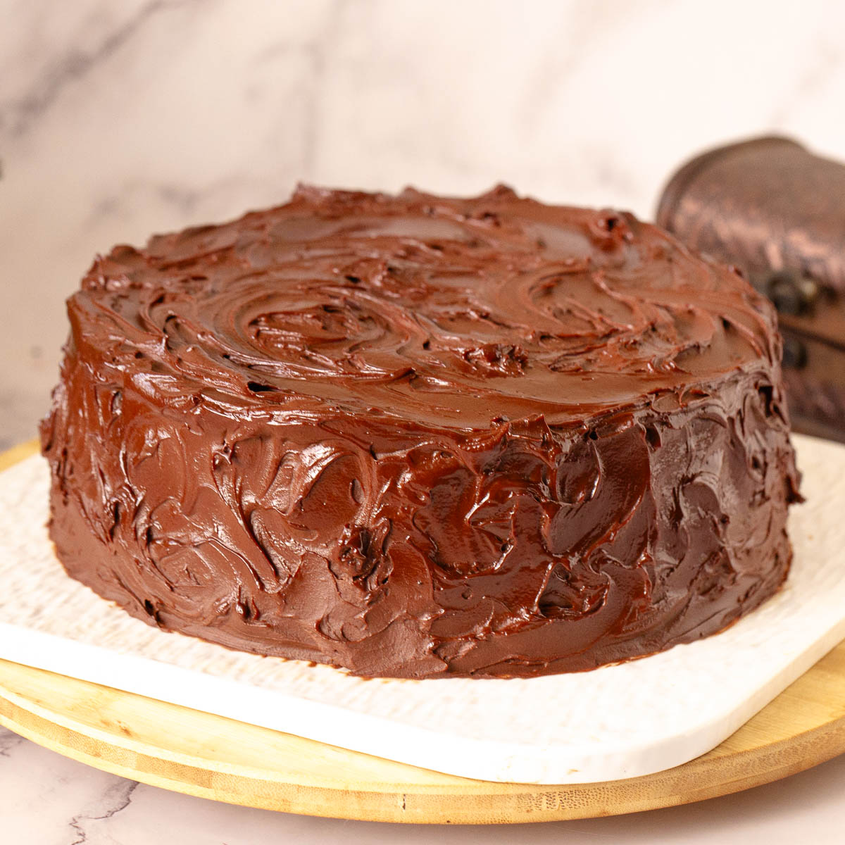 Frosted mud cake on the cake stand.