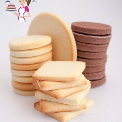 A stack of sugar cookies on a table.