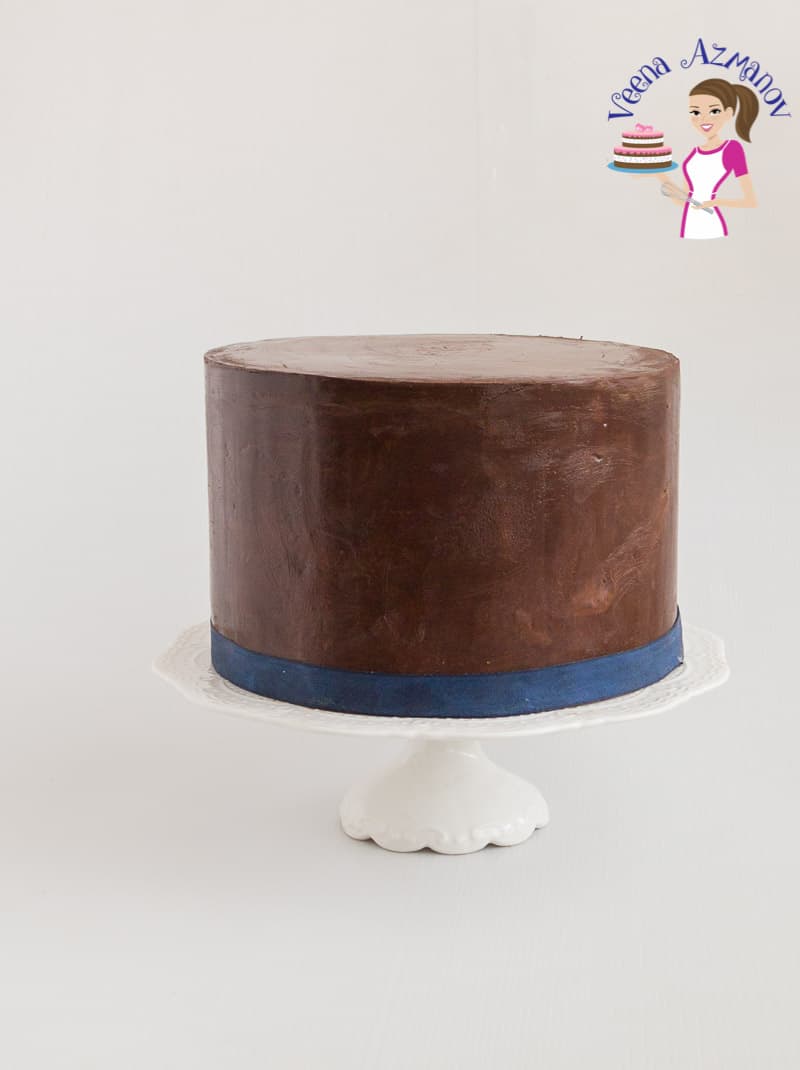 A cake decorated with chocolate ganache.