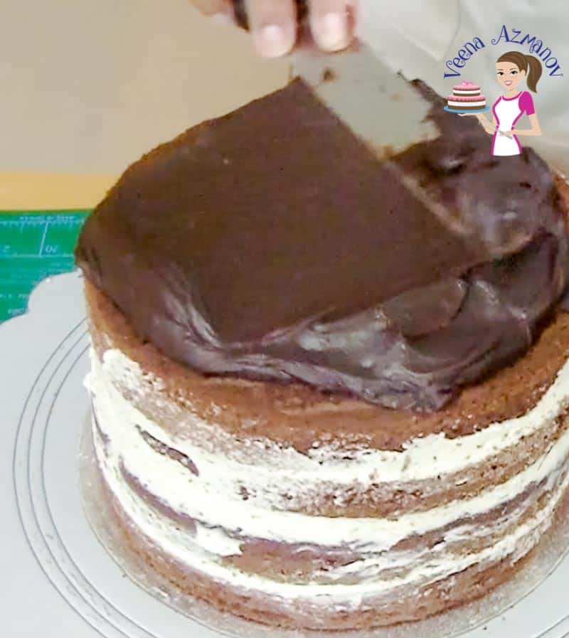 Decorating a cake with chocolate ganache.