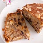 A piece of fruitcake on a plate.