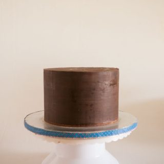 A buttercream cake with sharp edges.