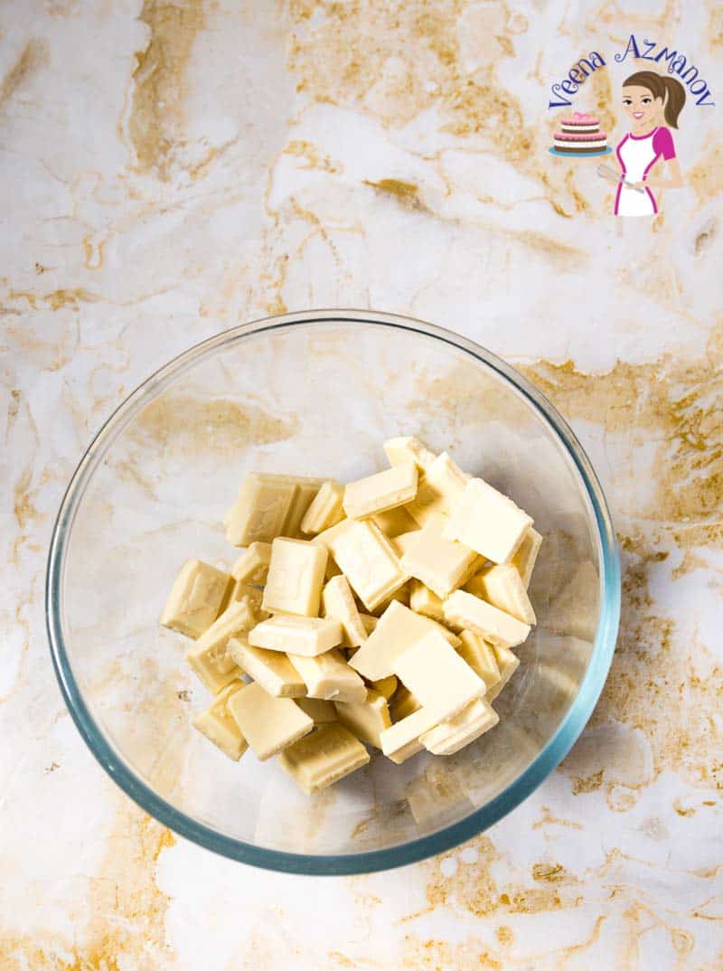 White chocolate pieces in a glass bowl.