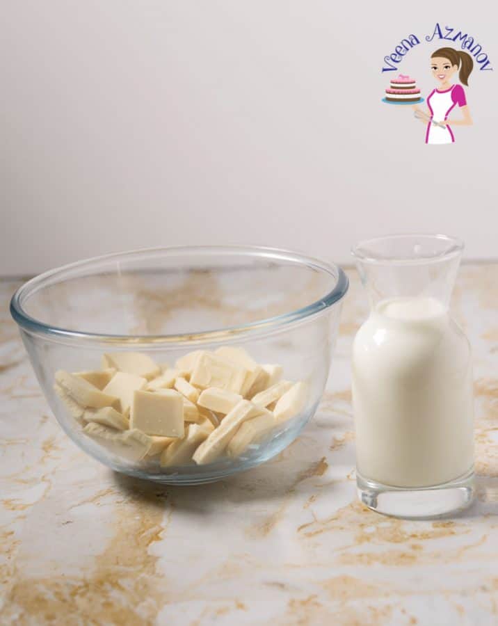 Pieces of white chocolate in a glass bowl.