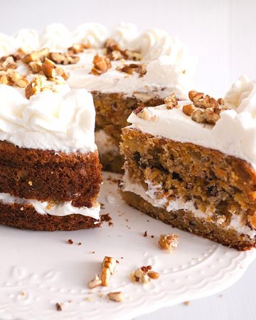 A frosted carrot cake with cream cheese frosting.