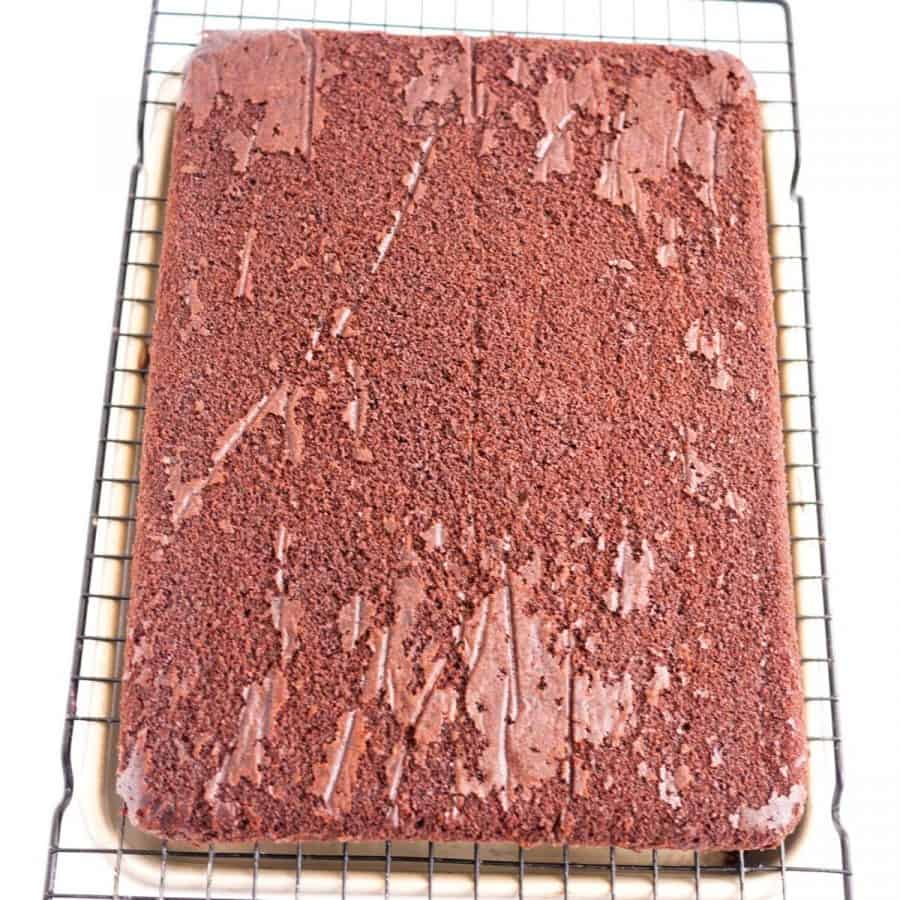 Sheet cake on a cooling rack.