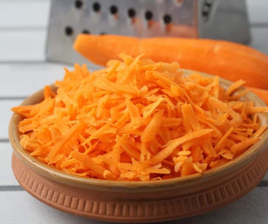 A bowl of grated carrots.