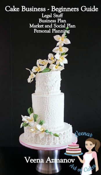 A decorated wedding cake with sugar flowers.