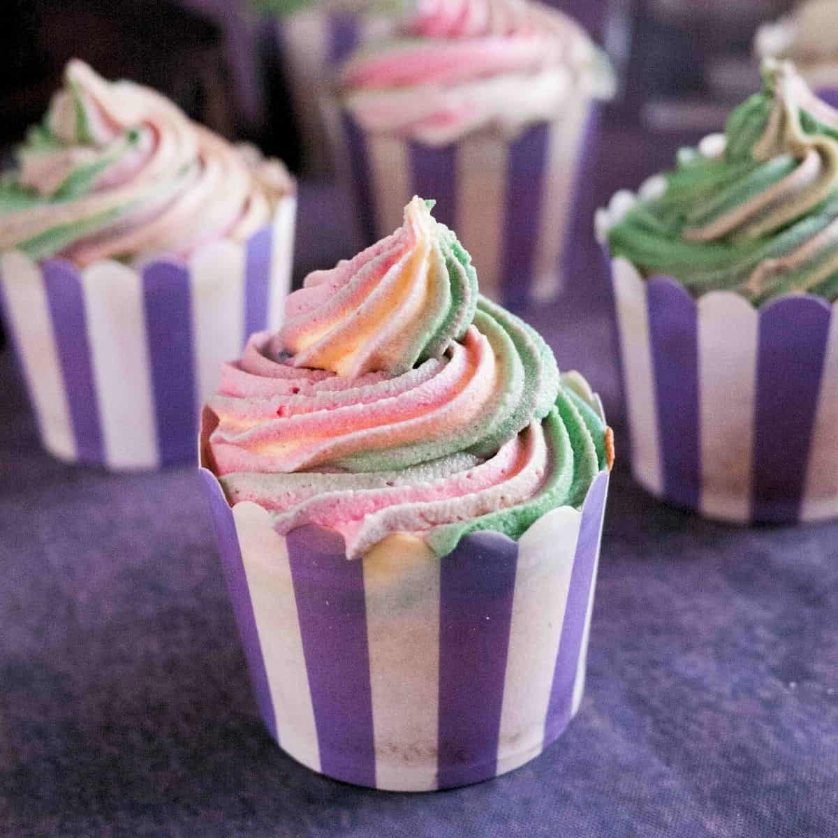 Frosted cupcakes on the table.