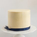 A frosted ganache cake with white chocolate ganache.