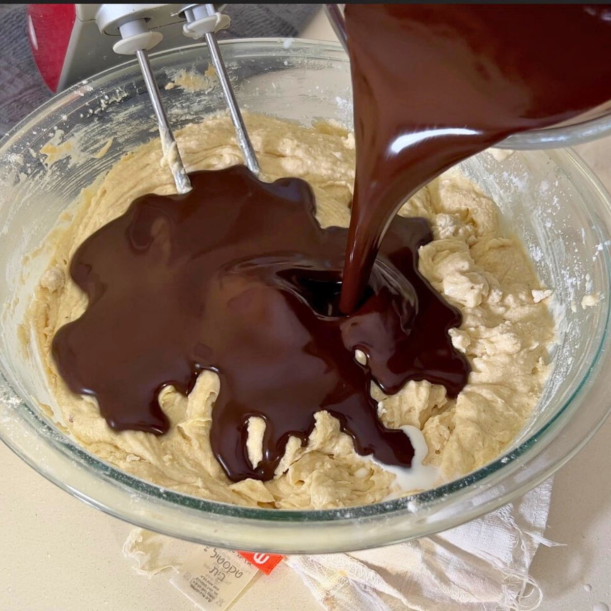 Adding cocoa paste to the devils food batter.