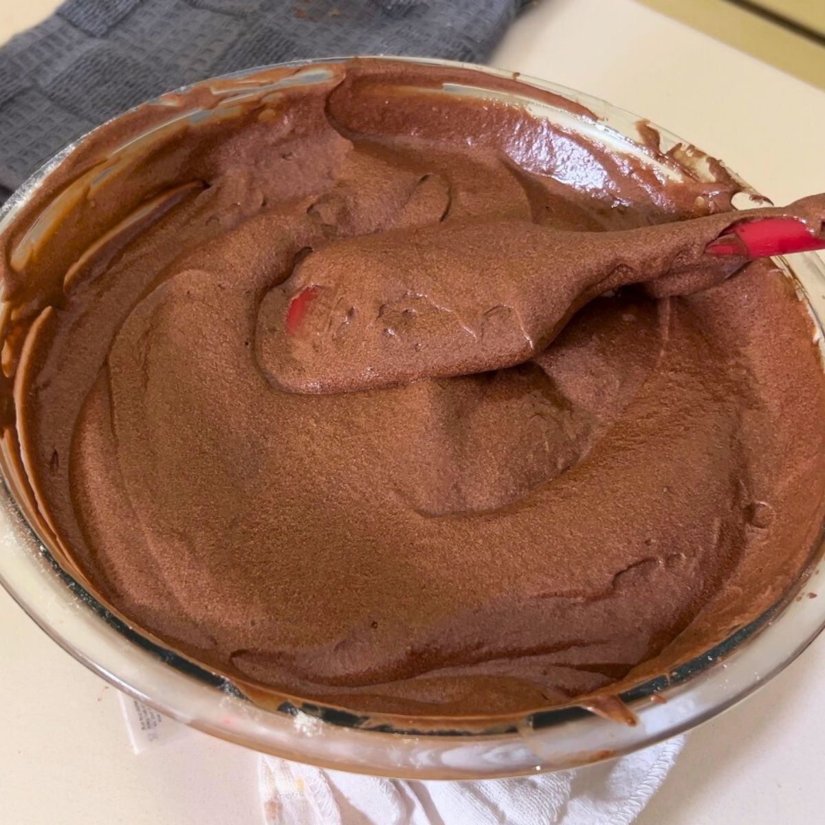 Devil's food cake batter in a glass bowl.
