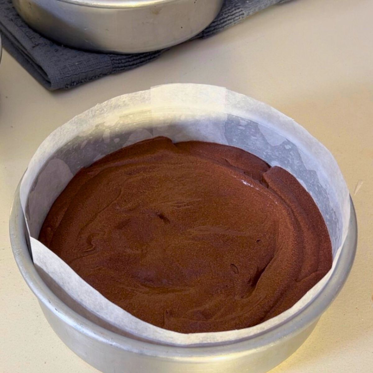 Devil's food batter in a cake pan.