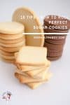 A stack of sugar cookies on a table.