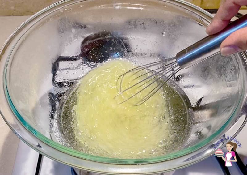 Whip egg whites with sugar over double boiler