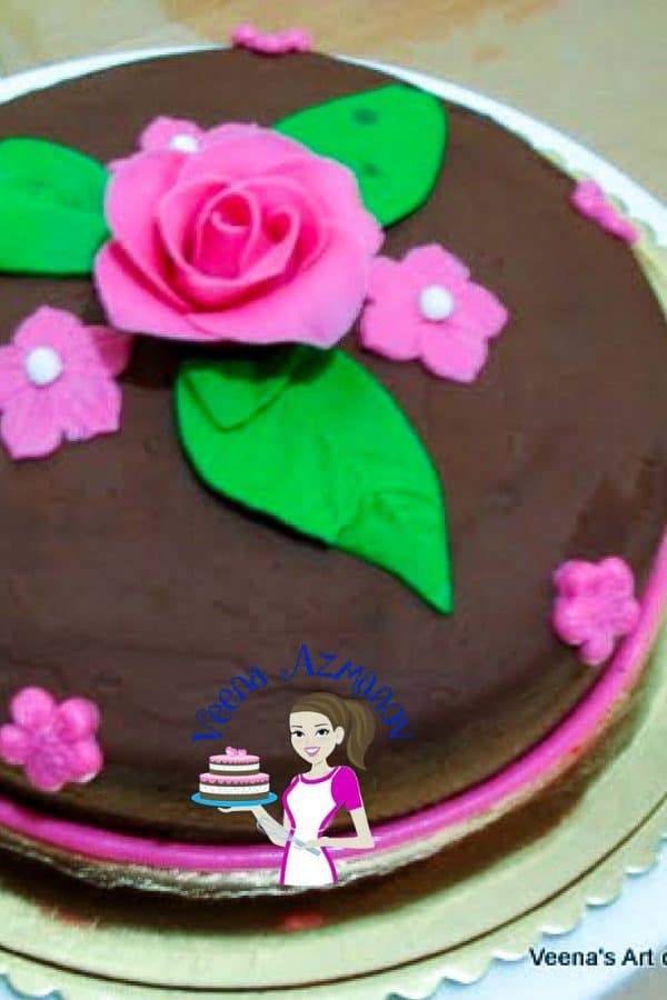 A close up of a decorated chocolate cake.