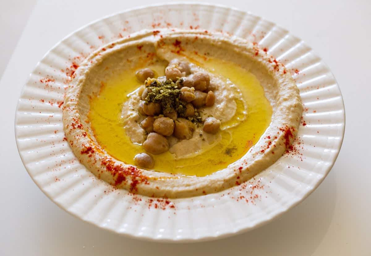 A bowl with fresh made hummus.