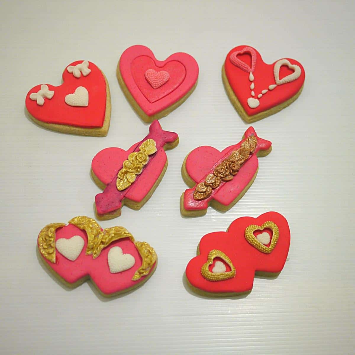 Valentine cookies with rolled royal icing.