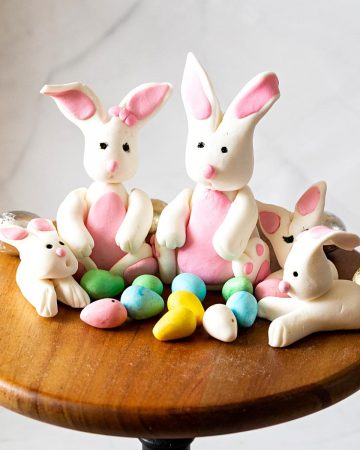 A cake stand with gum paste bunnies.