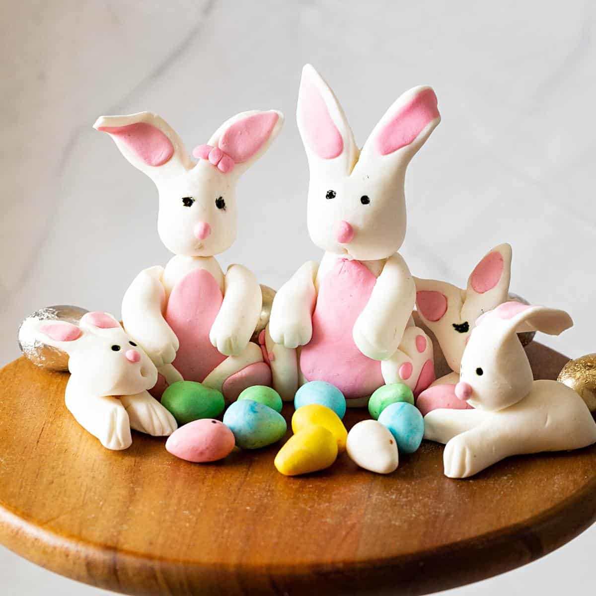 Bunnies with gum paste on the table.
