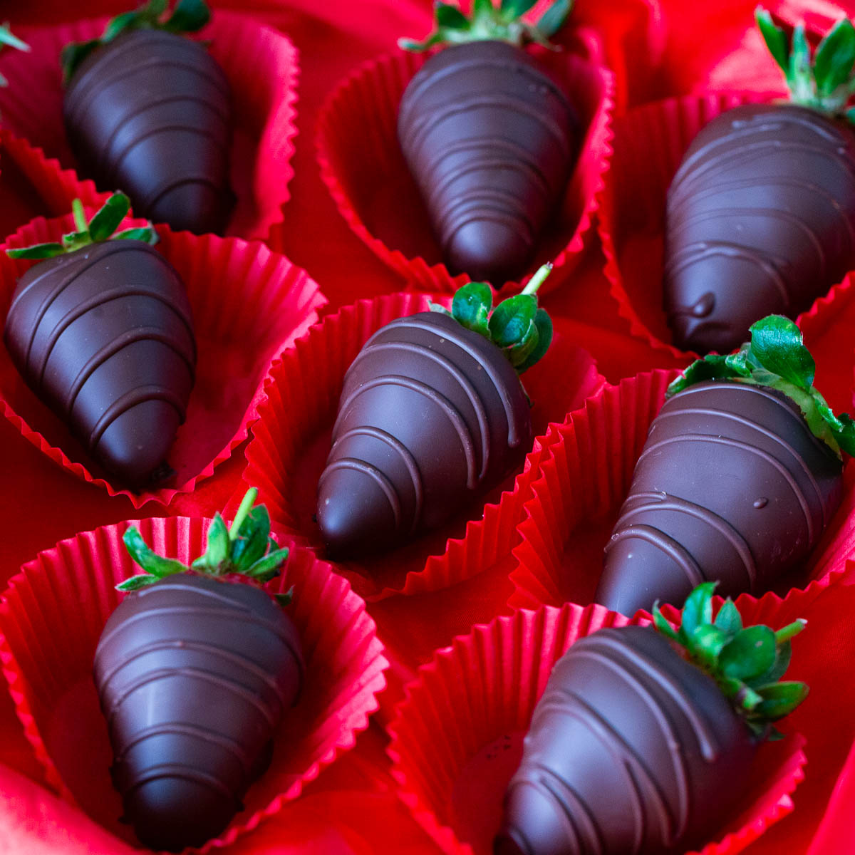Strawberries covered in dark chocolate.