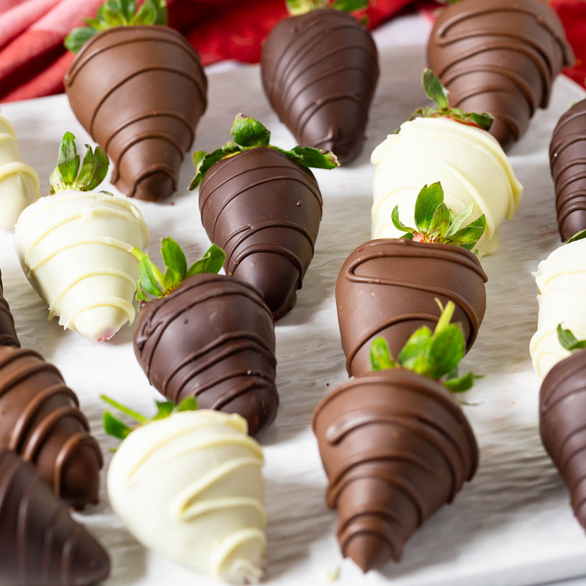 Strawberries covered in dark, milk and white chocolate.