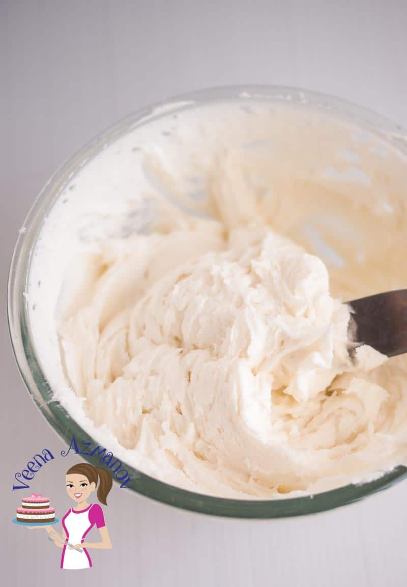 A bowl with cream cheese frosting.