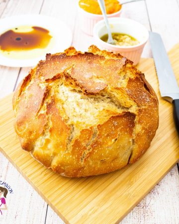 A crusty bread on a cutting board.