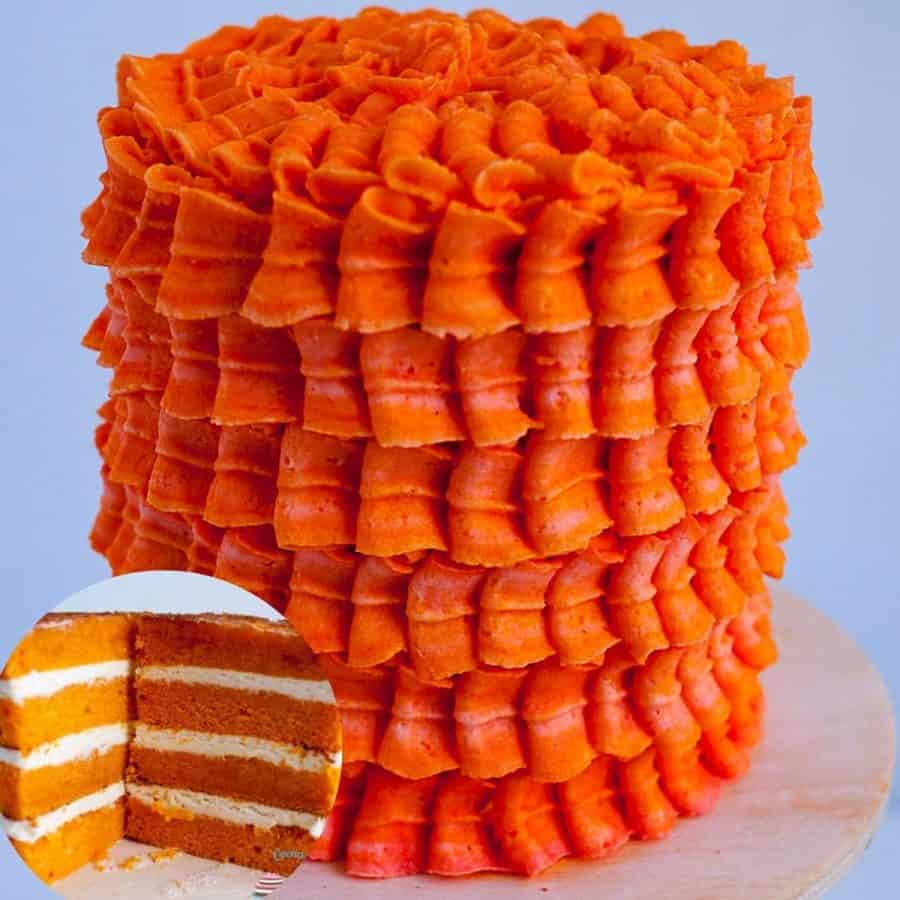 A frosted orange cake with Swiss meringue buttercream.