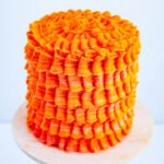A frosted orange cake with SMBC.
