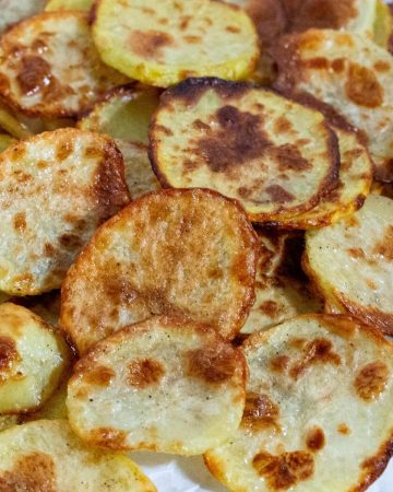 Baked potato chips on a plate.