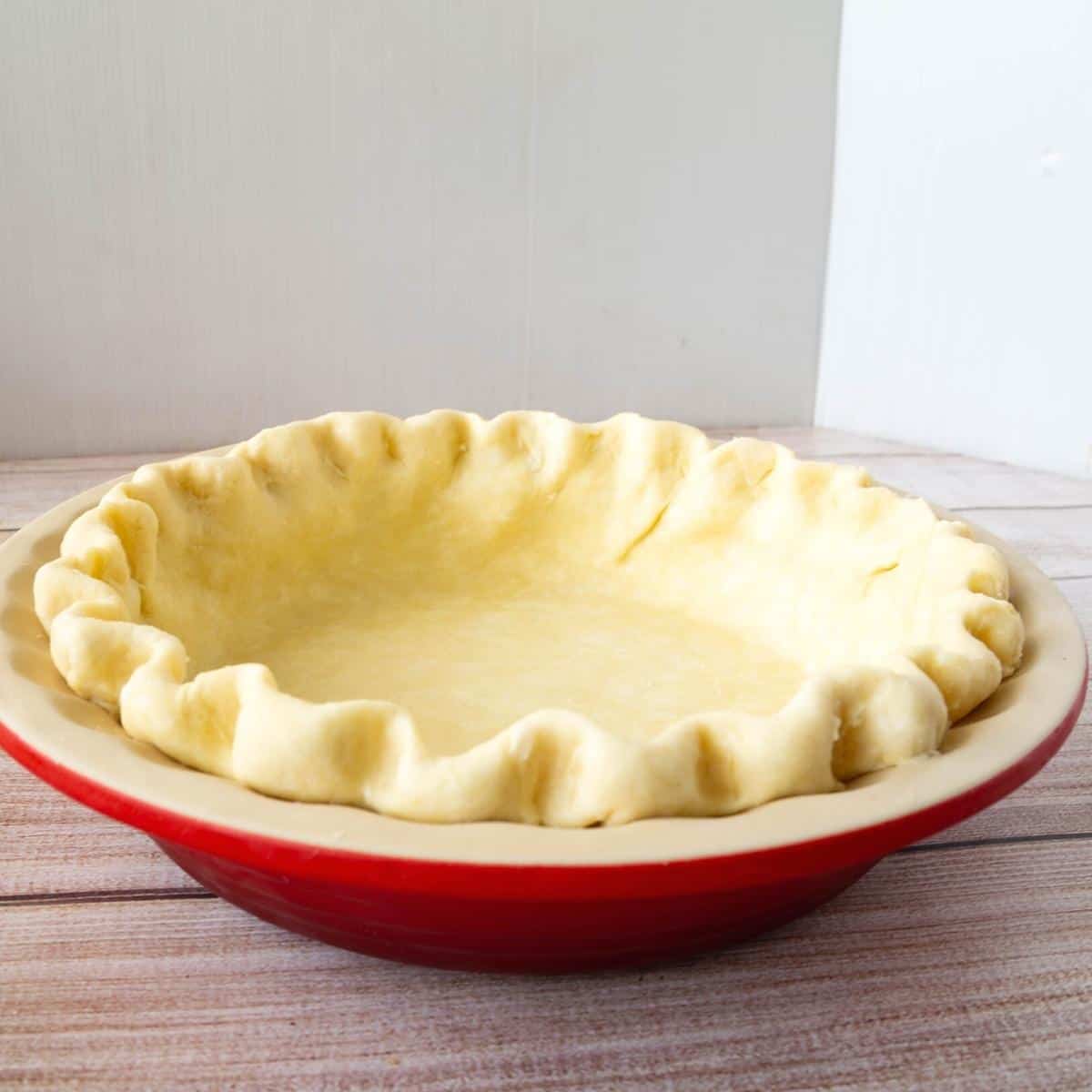 A pie crust in a pie pan.