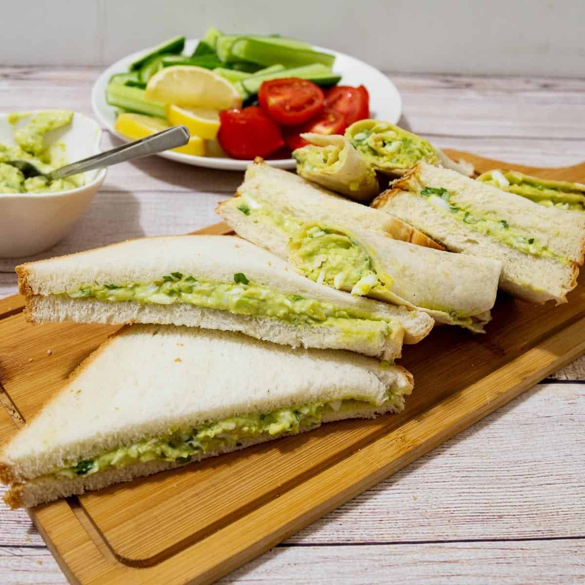 Sandwich bread slices with avocado egg spread.