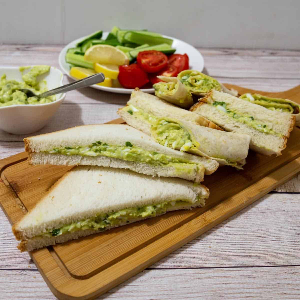 Sandwiches on a wooden board.