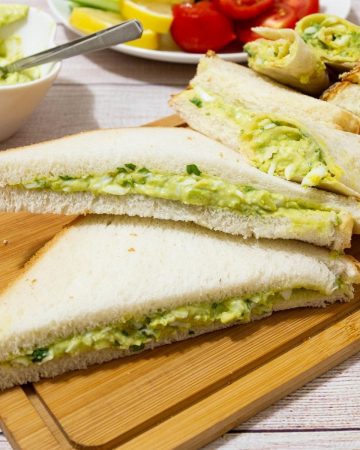 Sandwiches on a wooden board.