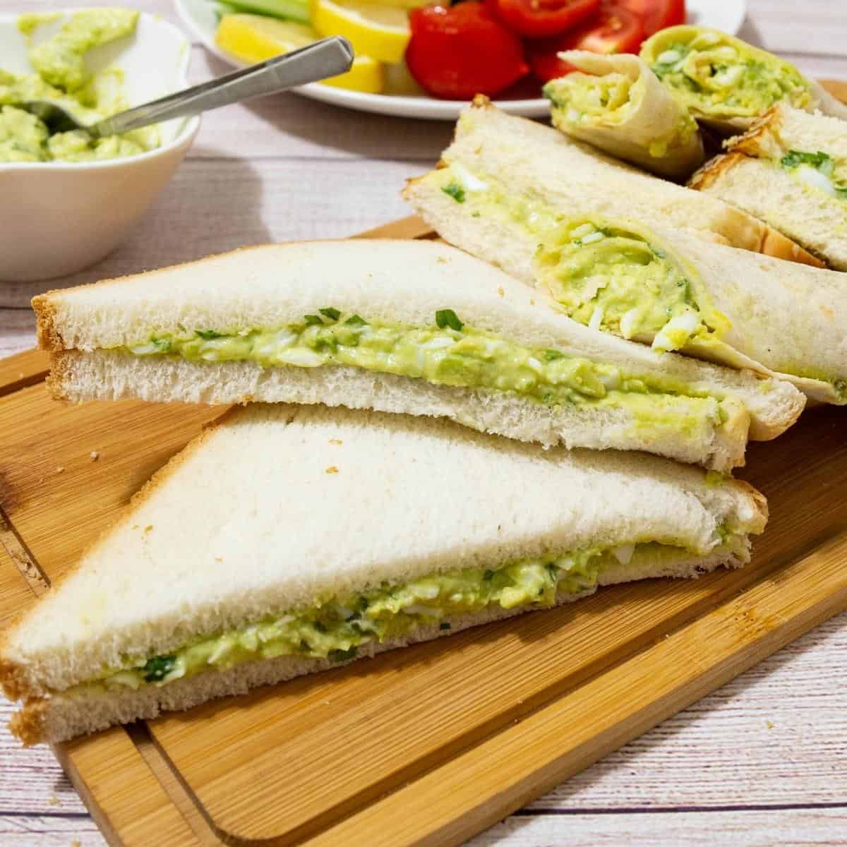 Sandwiches on a wooden board.