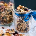 A jar full with fruit and nut granola.