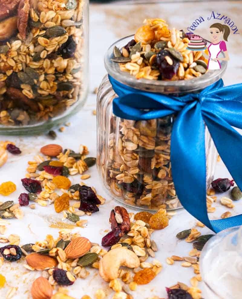 A jar filled with fruit and nut granola.