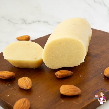 marzipan and almonds on a wooden baord
