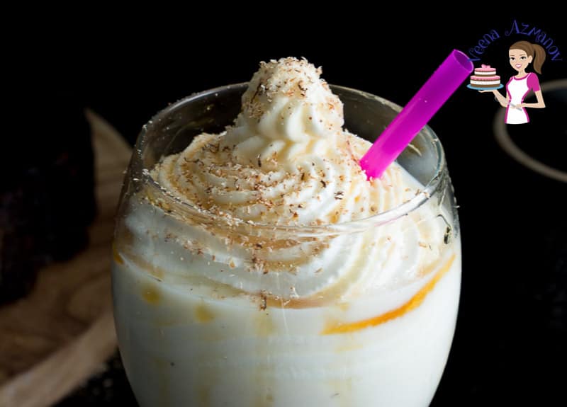 Whipped cream piped over maple eggnog.