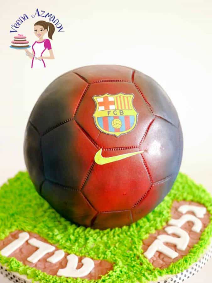 A cake decorated to look like a FC Barcelona soccer ball.