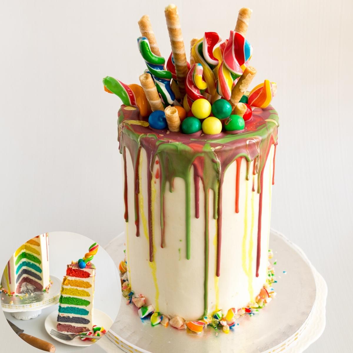 Rainbow layer cake topped with candy and wafer