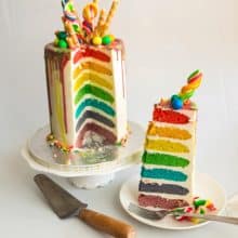 Rainbow cake topped with candy and wafer