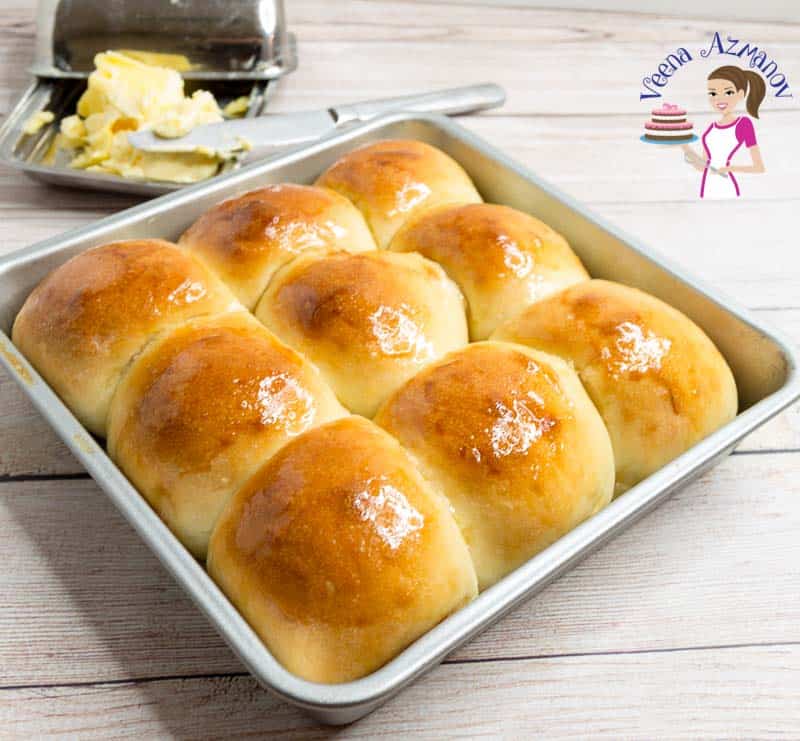 Soft dinner rolls in a baking pan.